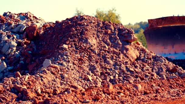 Static Shot Bulldozer Pushing Red Blue Clay Stones Large Metal — Stock Video