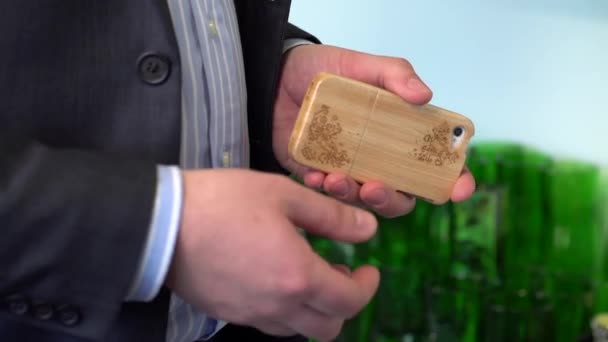 Close Shot Business Man Holding Mobile Phone Wooden Frame Engravings — Stock Video