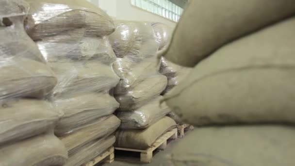Dolly Wide Shot Warehouse Full Gunny Sacks Several Them Wrapped — Stock Video