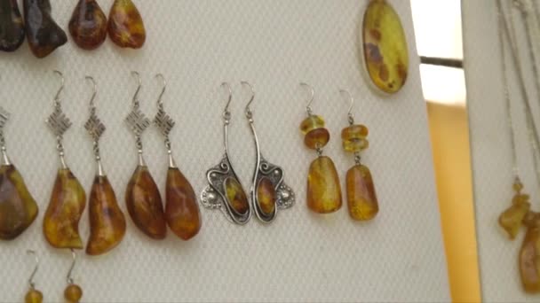 Dolly Close Shot Amber Jewelry Earrings Exhibited Craft Market — Stock Video