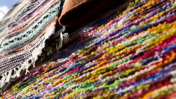 Different Colorful Blankets Hanging Stand Artisan Market Weaving Method Textile — Stock Video