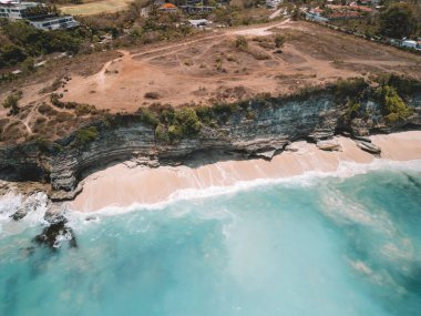 Aerial view at the Cliffs of Dreamland Bali, showing the soon to be sold property lots above the beautiful blue ocean clipart
