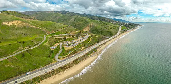 stock image Highway 1 California. Aerial Panorama of the coastline and road. Green hills and beach on side. High quality photo