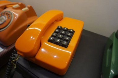 vintage old orange analog land line phone clipart