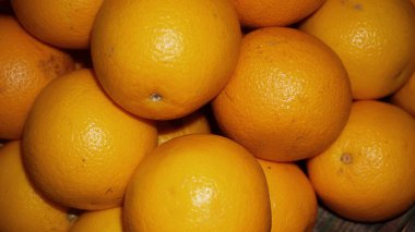 Fresh group of Mandarin oranges. pile of oranges in a fridge.