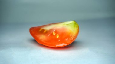 sliced healthy tomato on white. Healthy food for human body.