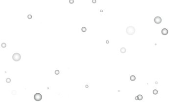 Işık gradyanı üzerinde yüzen kabarcıklarla soyut arkaplan.