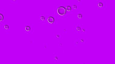 Soyut pembe arkaplan çeşitli boyutlarda şeffaf kabarcıklarla canlandırıldı.