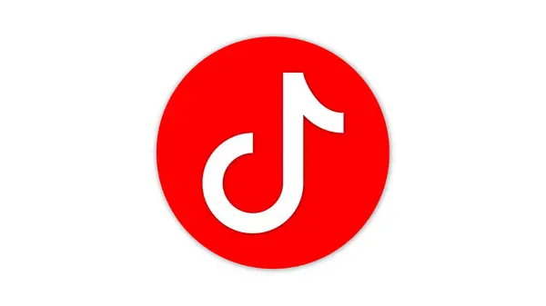 Merkezinde beyaz nota sembolü olan kırmızı dairesel bir logo TikTok uygulamasını temsil ediyor..