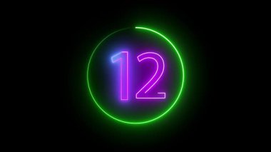 Renkli neon yüzük 12 sayısını kusursuz bir döngüyle özetliyor. Her renk bir diğerine akıyor. Zifiri karanlık bir tuval üzerinde canlı bir ışık gösterisi gibi..