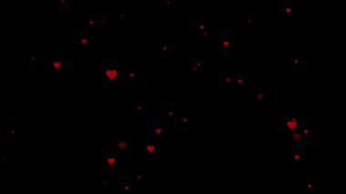 Uçan kalpler animasyonu, aşk mesajları, sosyal medya iletileri veya video şablonları için harika parlayan parçacıklar ile siyah arkaplan üzerinde döngü oluşturuluyor.