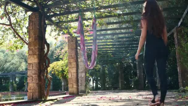 Aerial Yoga Woman Walks Hanging Hammock Mid Shot — Stockvideo