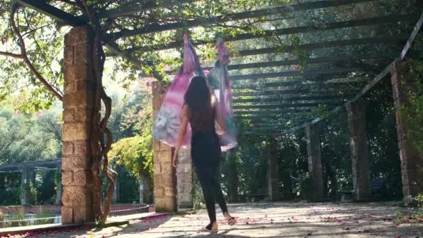 Aerial Yoga Woman Sits Hanging Hammock Garden Mid Shot — Vídeo de Stock