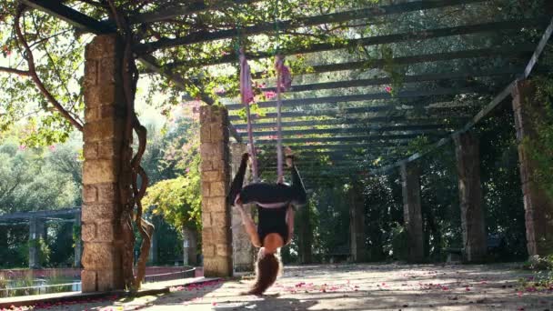Aerial Yoga Woman Exercising Hanging Hammock Garden Hanging Her Head — Video Stock