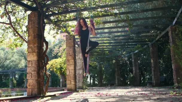 Woman Doing Aerial Yoga Outdoors Standing One Leg Hanging Yoga — Video