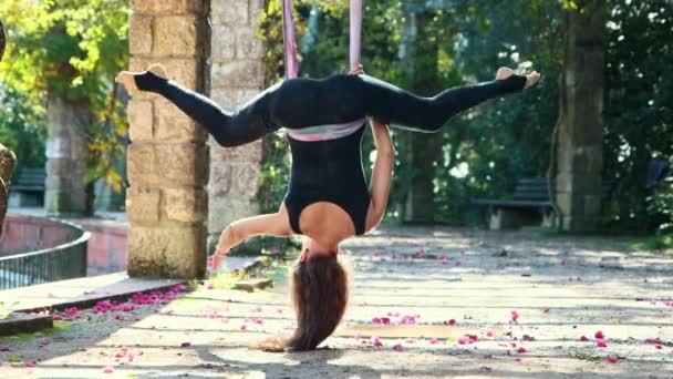 Woman Doing Aerial Yoga Exercises Using Yoga Hammock Mid Shot — Vídeos de Stock