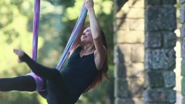 Woman Doing Aerial Yoga Exercises Mid Shot — Stockvideo