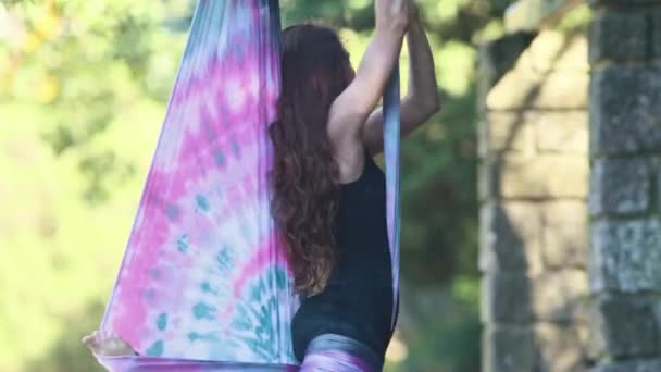 Pretty Woman Doing Aerial Yoga Outdoors Mid Shot — Stockvideo