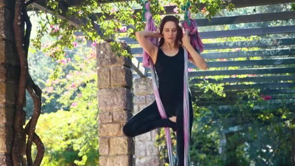 Woman Doing Aerial Yoga Fixes Her Hair Balancing Hammock Her — Vídeos de Stock