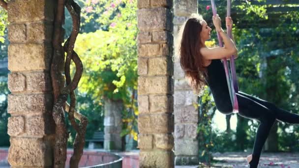 Happy Woman Sports Suit Swinging Yoga Hammock Mid Shot — Vídeo de Stock