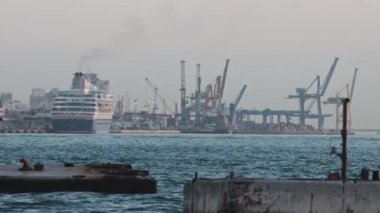 28 November 2022 LISBON, PORTUGAL: river port and industrial plants by the river. Mid shot