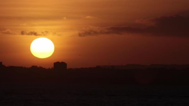 Large Bright Sun Rises River City Orange Light Mid Shot — Video