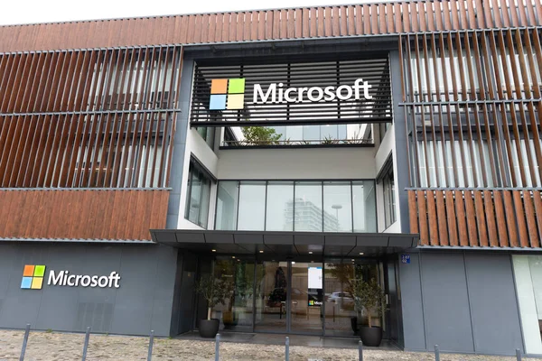 PORTUGAL, LISBON 12 december 2022: Microsoft logo on facade of their three-story office building. Mid shot