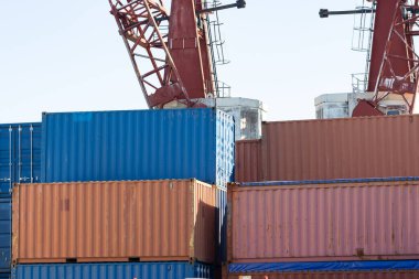 A bunch of cargo containers in the open air. Mid shot