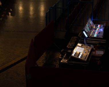 Control panels for sound and light on the stage. Mid shot