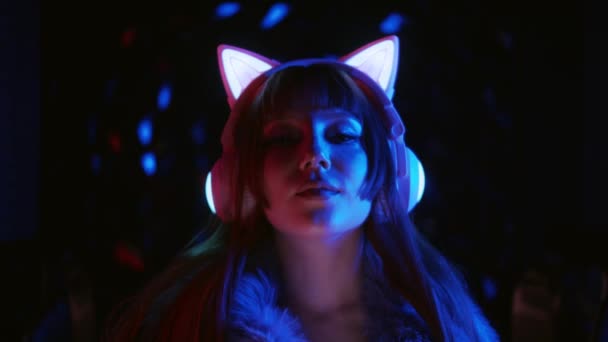 Sexy Gamer Girl Wearing Makeup Headphones Cat Ears Neon Lighting — Stock video