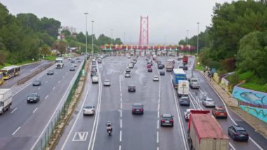 20-12-2022 PORTUGAL, LISBON: cars and trucks drive along the highway to the checkpoint. Mid shot