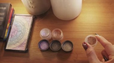 Shiny shadows and glitter on the table. Mid shot