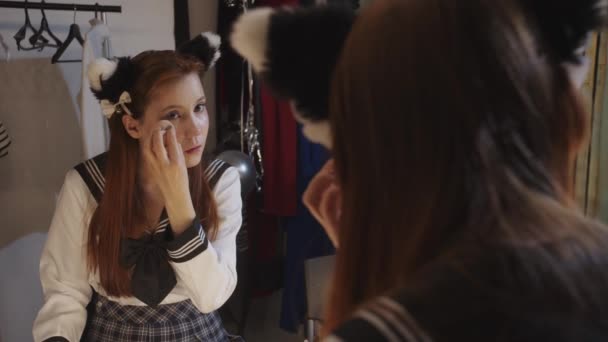 Young Woman School Uniform Blending Foundation Her Face Using Sponge – Stock-video
