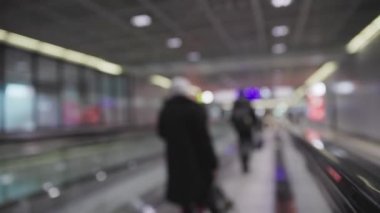 Autowalk in the airport - blurred footage. Mid shot
