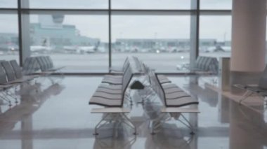 White airport lounge from the moving perspective. Mid shot