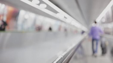 Travolator in the airport - blurred footage. Mid shot
