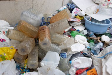 16 october 2022 Almada, Portugal: dirty five-liter plastic bottles in a recycling dump. Mid shot