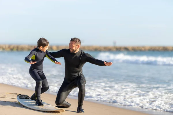 Smiling Father Teaching His Son How Surf Mid Shot Stock Picture