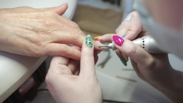 Woman Does Hardware Manicure Her Client Close — Stock Video