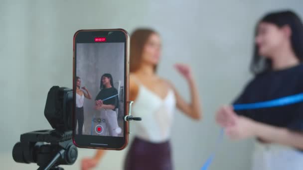 Young Woman Talking Phone Camera Takes Measurement Body Slim Model — Stock Video