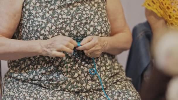 Elderly Thick Woman Weaves Cup Stand Mid Shot — Stock Video