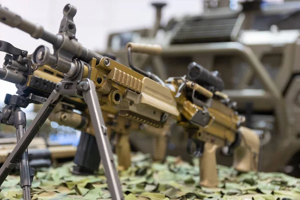 stock image Military weapons, possibly rifles or machine guns, aligned for exhibition.