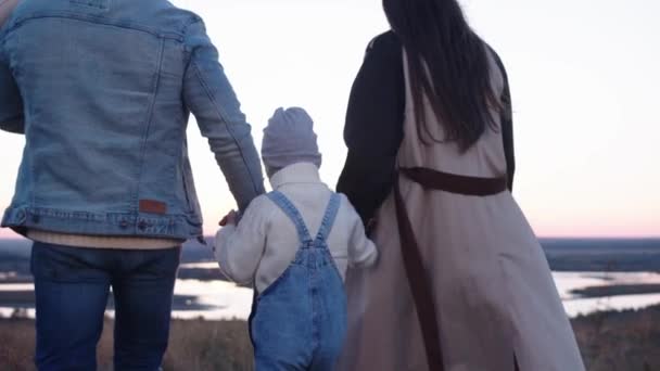 Man Woman Holding Hands While Walking Child — Stock Video