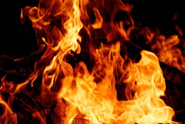 Huge bonfire burning wood fire ignited to celebrate Holi festival , Borivali , Bombay Mumbai , Maharashtra , India clipart