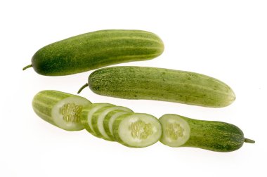 Vegetable , full Cucumber with slices on white background clipart
