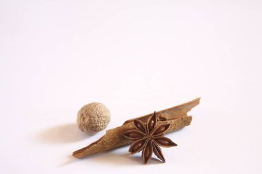 Spice, Cassia Jungli Dalchini Cinnamomum cassia Nutmeg Jaiphal Myristica fragrance Star Anise Anasphal Illicium verum on white background   clipart