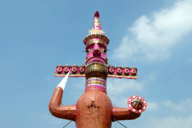 Ten heads demon king of Lanka Ravana made for dahan celebrating Dussera festival at Shivaji park, Dadar, Bombay Mumbai, Maharashtra, India  clipart