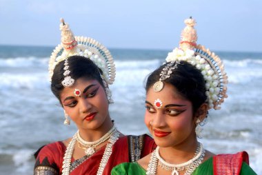 Dancers performing classical traditional odissi dance, Konarak, Orissa, India  clipart