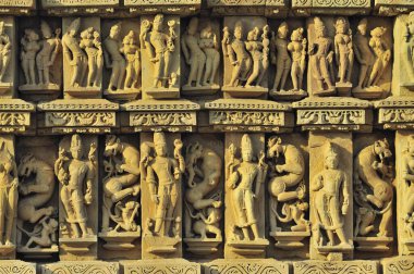 Intricately carved wall of parsvanatha temple Khajuraho madhya pradesh india clipart