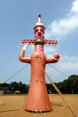 Ten heads demon king of Lanka Ravana made for dahan celebrating Dussera festival at Shivaji park, Dadar, Bombay Mumbai, Maharashtra, India 2008  clipart